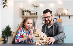 father-daughter-playing-with-wood-blocks